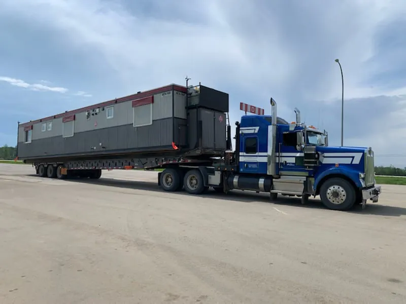 Wild Horizon Ventures kenworth winch tractor hauling oilfield camp