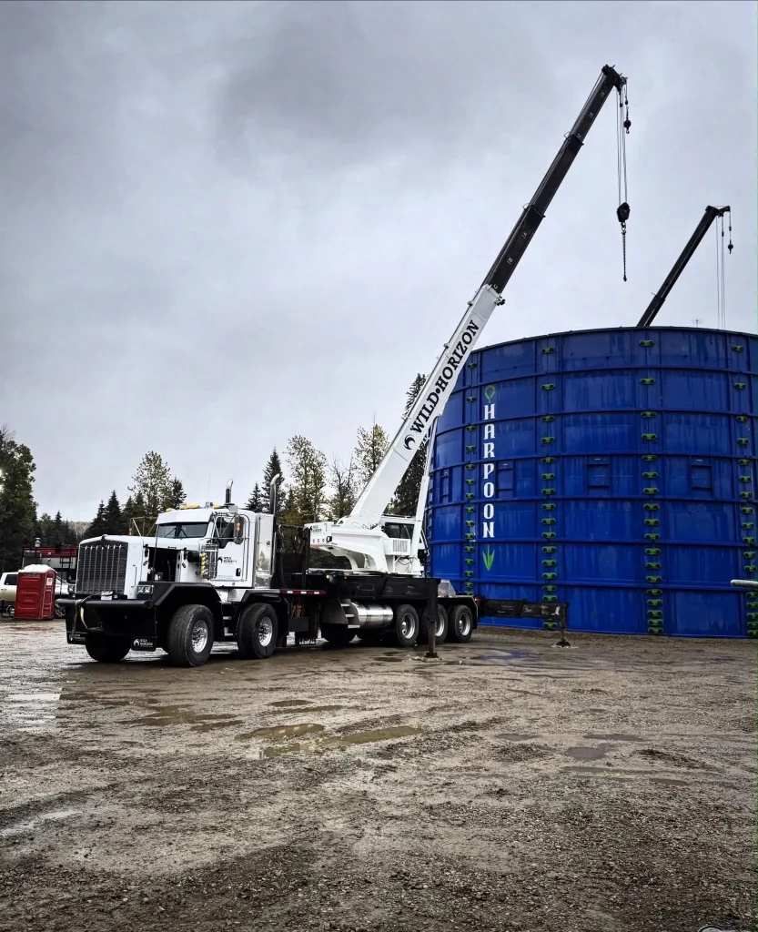 Wild Horizon Ventures picker crane lifting storage tank