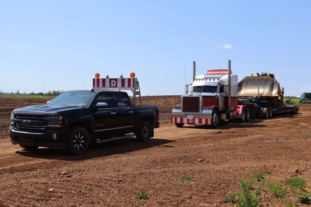 Wild Horizon Ventures pilot car escort dozer lowbed haul
